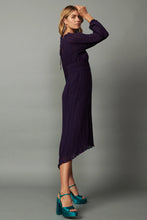 Load image into Gallery viewer, This V-neck midi dress is delicately pleated, sheer, and has ruffle trim on the shoulders. The elasticized waist creates a flattering silhouette with a high-low hem, front slit, and lettuce edge. A charming back tie completes the look.