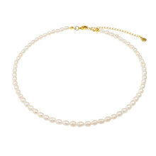Load image into Gallery viewer, Timeless white pearl necklace with gold chain, adorned with genuine freshwater pearls and adjustable length.