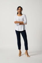 Load image into Gallery viewer, Woman wearing a white top and navy pants on a plain background