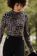 Load image into Gallery viewer, Chic animal print top in jersey fabric with long sleeves, fitted silhouette, and mock neck. Pair with black trousers and heels for a night out.