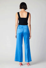 Load image into Gallery viewer, A bold, high-waisted pair of wide-leg pants with a loose fit. These vibrant pants uplift your mood with their bright colors and clean waistband.