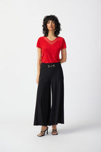 Load image into Gallery viewer, Stylish woman in red top and black wide-leg pants, featuring a wide waistband and gold accent, radiating timeless elegance.