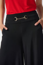 Load image into Gallery viewer, Embrace timeless elegance with these wide-leg culotte pants, crafted from a silky knit fabric for a sleek and sophisticated look. The flared cut and wide waistband ensure comfort and style for any occasion.