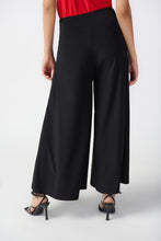 Load image into Gallery viewer, Make a fashion statement with these wide-leg culotte pants, tailored in a silky knit fabric for a sleek and stylish appearance. The flared cut and wide waistband offer both comfort and timeless elegance.