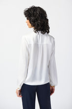 Load image into Gallery viewer, Chic satin top with notch collar, lapels, and centre-front ties. Puff sleeves adorned with gold buttons. Sleek yokes at front and back for style.