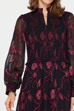 Load image into Gallery viewer, Smocked midi dress with flattering silhouette and sheer long sleeves. Black with red floral design.
