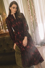 Load image into Gallery viewer, Smocked midi dress with flattering silhouette and sheer long sleeves. Black with red floral design.