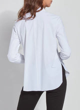Load image into Gallery viewer, A woman in a white shirt & black pants - the Connie Slim Button Down. Perfect for any occasion, its slim fit & longer back hem creates a stylish silhouette.