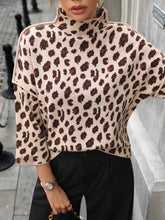 Load image into Gallery viewer, Person wearing a leopard print sweater with a blurred background