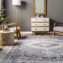 Load image into Gallery viewer, Enhance your living room with this elegant blue and white area rug, boasting a flat pile and integrated non-slip backing.