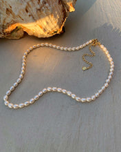 Load image into Gallery viewer, Chic pearl necklace featuring genuine freshwater pearls, adjustable length, and a touch of modernity.