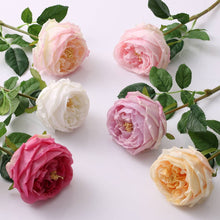 Load image into Gallery viewer, Enhance your floral designs and wedding bouquets with the exquisite beauty of Real Touch roses in different colors, delicately arranged on a white surface.