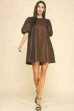 Load image into Gallery viewer, Woman wearing a brown dress with puff sleeves on a beige background