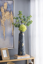 Load image into Gallery viewer, Decorative glass vase with wide, curved silhouette, short neck, round opening, dazzling blue hue, and gold flashes.
