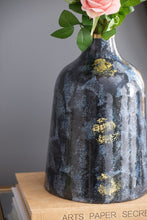 Load image into Gallery viewer, Decorative blue glass vase with gold flashes. Wide, curved silhouette, short neck, and round opening. Perfect for a contemporary touch.