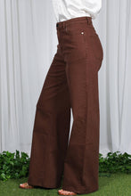 Load image into Gallery viewer, Brown wide-leg pants worn by a person standing on grass with a white curtain background