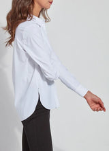 Load image into Gallery viewer, Image shows a woman in a tailored slim-fit button-down shirt, made of wrinkle-resistant Microfiber and four-way stretch blend fabric for everyday wear.