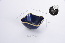 Load image into Gallery viewer, Square snack bowl in Sunset By The Sea. Perfect for individual snacking, dips, or toppings. Adds elegance to any bar with lemons and limes. Made of blue glazed porcelain with gold-tone rims. Food safe, dishwasher safe, and oven safe to 500°. Easy to care for.