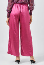 Load image into Gallery viewer, Pink wide-leg pants worn by a person on a white background
