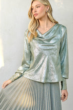 Load image into Gallery viewer, Woman wearing a silver metallic top and skirt against a neutral background
