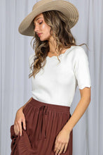 Load image into Gallery viewer, Woman wearing a white top and brown skirt with a beige hat against a light gray background