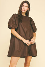 Load image into Gallery viewer, Woman wearing a brown dress with puff sleeves on a beige background