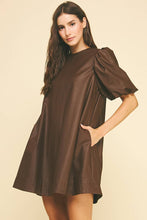 Load image into Gallery viewer, Woman wearing a brown dress with puff sleeves on a beige background