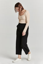 Load image into Gallery viewer, Soft and stretchy cropped wide leg pants in black. High rise, flattering silhouette, and comfortable fit. Versatile and stylish for any occasion.