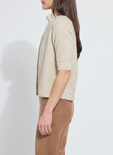 Load image into Gallery viewer, Lysse Kennedy Sleeve Lurex Feather Cardigan. Color is in Nude with accents of gold shimmery feathers.