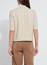 Load image into Gallery viewer, Lysse Kennedy Sleeve Lurex Feather Cardigan. Color is in Nude with accents of gold shimmery feathers.