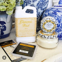 Load image into Gallery viewer, An elegant bottle of Diva laundry wash resting on a soft towel, radiating a sense of luxury.