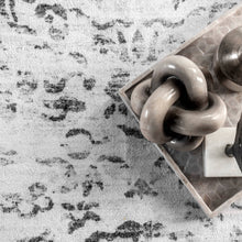 Load image into Gallery viewer, Stylish tray adorned with a trio of rings, symbolizing nuLOOM&#39;s commitment to blending art and functionality in their machine-made, washable floor coverings.
