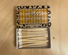Load image into Gallery viewer, Matches with Tyler logo lighting a candle. Perfect for igniting your favorite scents. Let the light shine!
