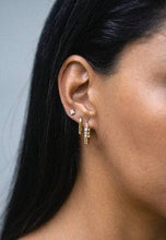 Load image into Gallery viewer, Enhance your style effortlessly with these gold-tone diamond hexagon hoop earrings. The crystal encrusted hexagon shape adds texture.
