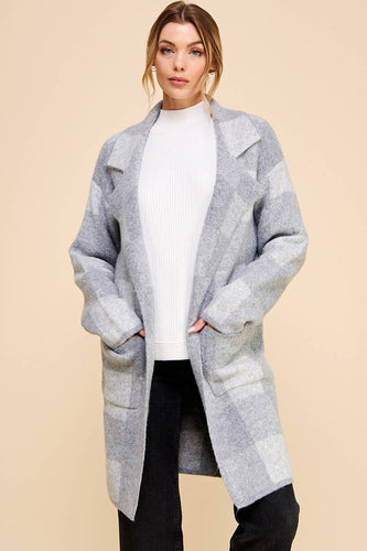 Grey plaid cardigan with structured pockets and collar. Soft, plush and elevated makes it great for versatile looks.