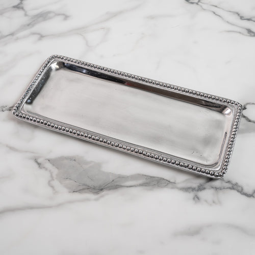Beaded trim enhances this eco-friendly tray, crafted from recycled aluminum for a refined look.
