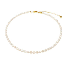 Load image into Gallery viewer, Timeless white pearl necklace with gold chain, adorned with genuine freshwater pearls and adjustable length.

