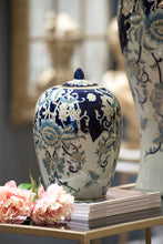 Load image into Gallery viewer, High-quality porcelain jar with blue and white floral patterns and gold accents. Versatile for storage, decor, or holding flowers.
