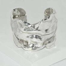 Load image into Gallery viewer, This Karine Sultan cuff, inspired by medieval foil, is as light as tissue paper. Its crumpled and thin design adds a sweet touch to any wrist.
