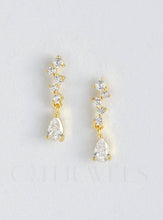 Load image into Gallery viewer, A pair of diamond earrings with white gold accents, styled as mini chandelier CZ drops, crafted from sterling silver.

