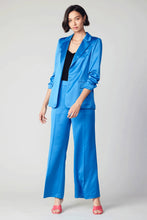 Load image into Gallery viewer, Featuring a high waist and loose fit, these wide-leg pants are a statement piece with their vibrant colors. The clean waistband and smart creasing add a polished touch.
