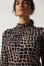 Load image into Gallery viewer, Elevate your style with this chic animal print top in jersey fabric. Features long sleeves, fitted silhouette, and mock neck. Pair with trousers or jeans.
