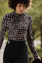 Load image into Gallery viewer, Chic animal print top in jersey fabric with long sleeves, fitted silhouette, and mock neck. Pair with black trousers and heels for a night out.
