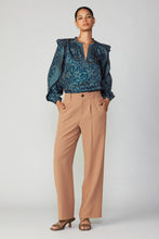 Load image into Gallery viewer, Model in blue blouse and wide-leg trousers. Pleated pants with partially elasticized waistband, slant front pockets, and welt back pockets.
