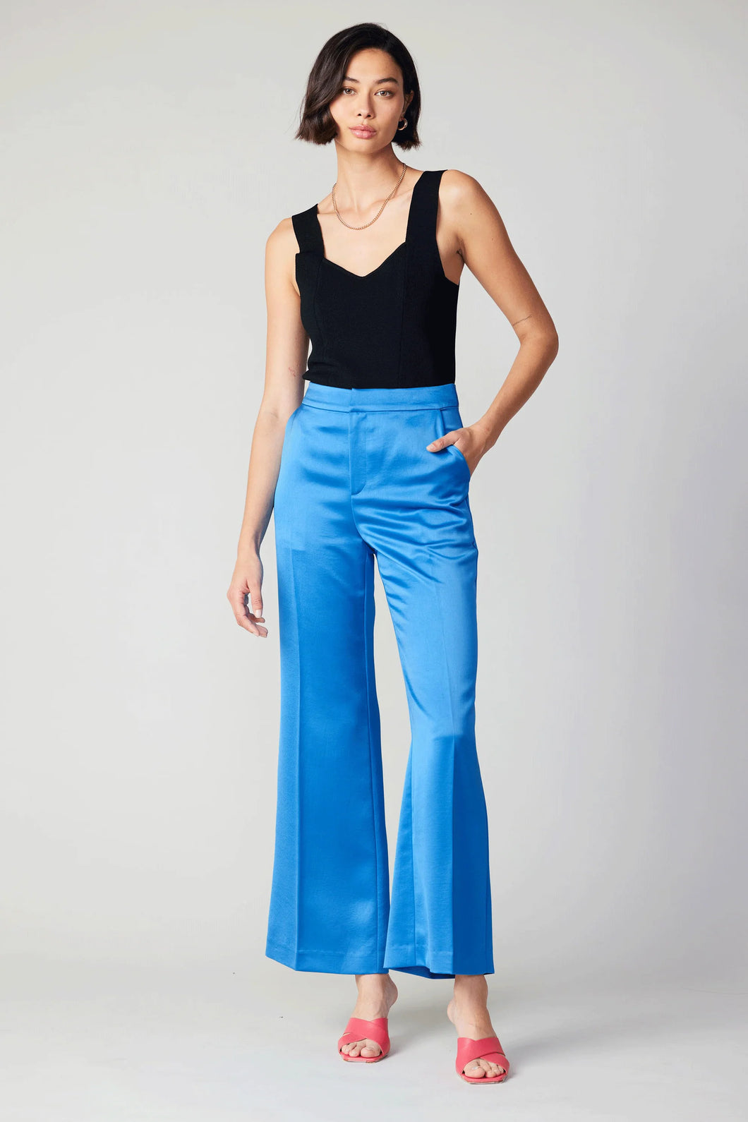 Elevate your style with these opulent wide-leg pants. With a high waist and loose fit, they add a touch of vibrancy and boldness to your ensemble. Featuring a sleek waistband and impeccable creasing, these pants are the epitome of elegance.