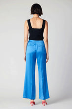 Load image into Gallery viewer, A bold, high-waisted pair of wide-leg pants with a loose fit. These vibrant pants uplift your mood with their bright colors and clean waistband.
