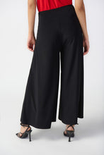 Load image into Gallery viewer,  Make a fashion statement with these wide-leg culotte pants, tailored in a silky knit fabric for a sleek and stylish appearance. The flared cut and wide waistband offer both comfort and timeless elegance.
