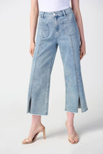 Load image into Gallery viewer, Cropped denim pant with high waist, four pockets, embellished front seam, slit, frayed hem - trendy and sophisticated culotte jeans.
