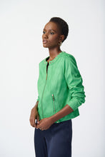 Load image into Gallery viewer, Elegant woman in a green jacket and pants, showcasing a foiled suede masterpiece with non-functional zipper pockets and a refined hook and eye closure.
