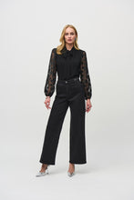 Load image into Gallery viewer, Wide-leg denim pants with side metallic trims on the waistband, featuring a flattering high waist for an elongated silhouette.
